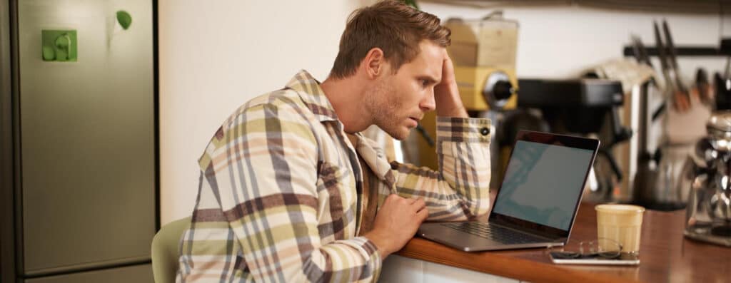 Frustrated small business owner dealing with IT problems and unreliable tech support